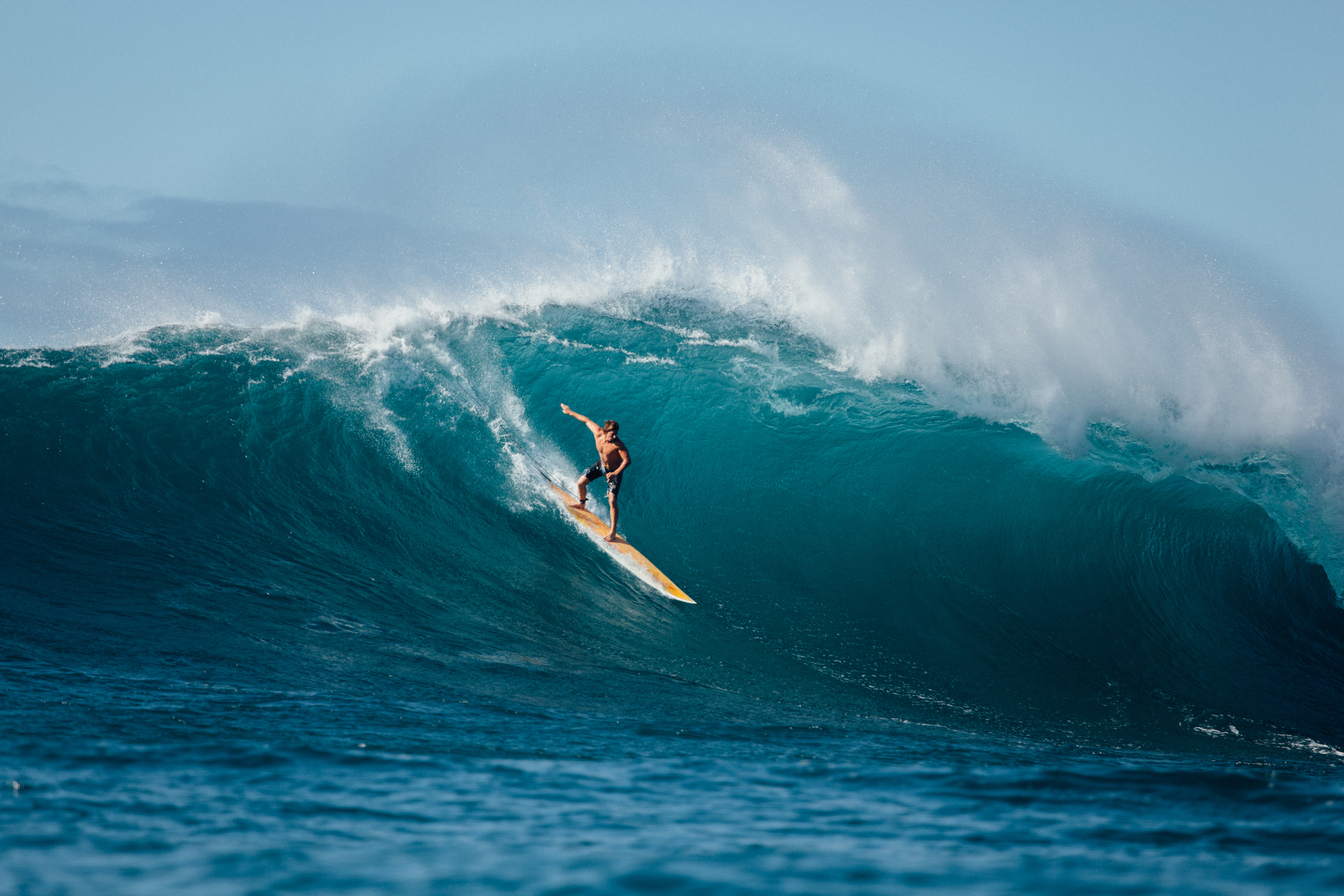 Surfer on massive wave in Portugal